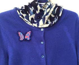 Brooch on cardigan