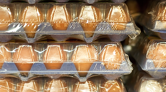 cartons+of+eggs+wrapped+in+shrink+wrap+film+stacked+together.png