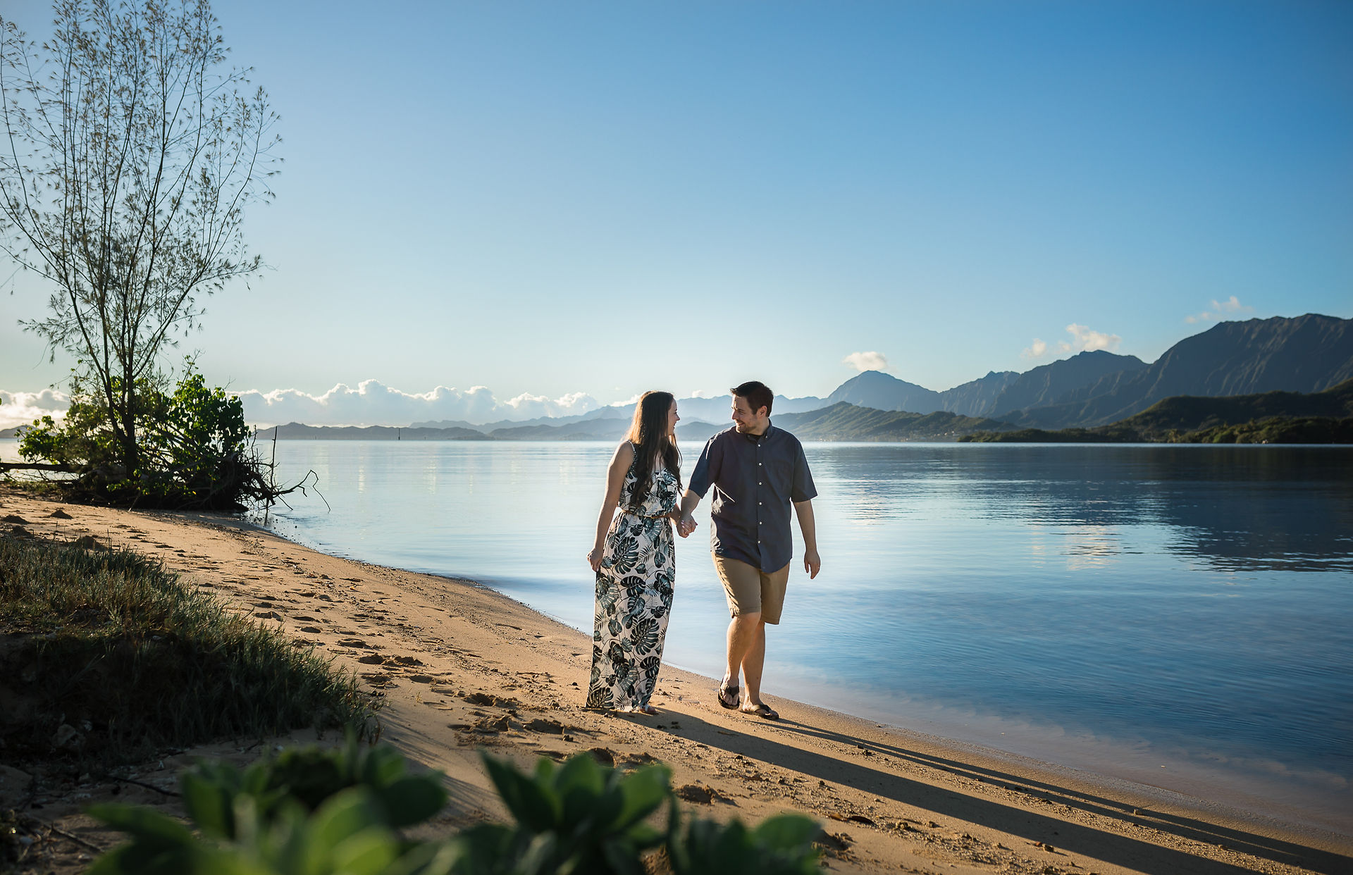 couple walking along with sand