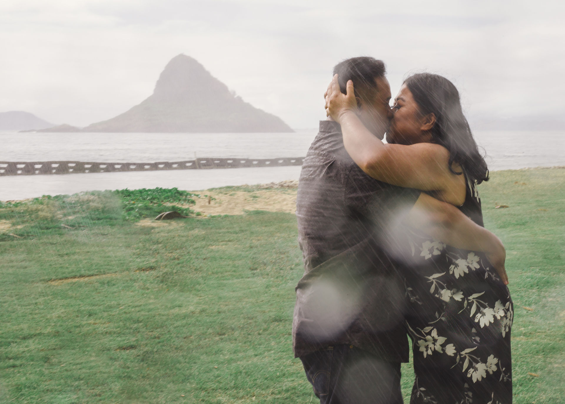 Couple kissing in the rain