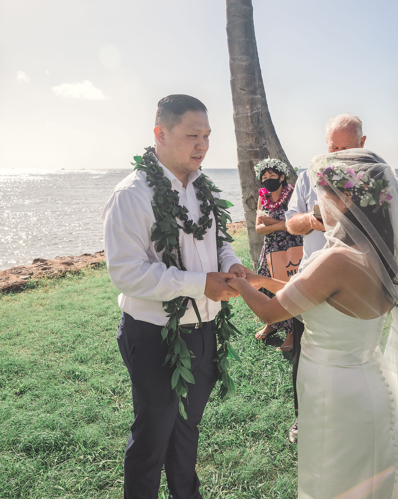 Bride and groom holding hands