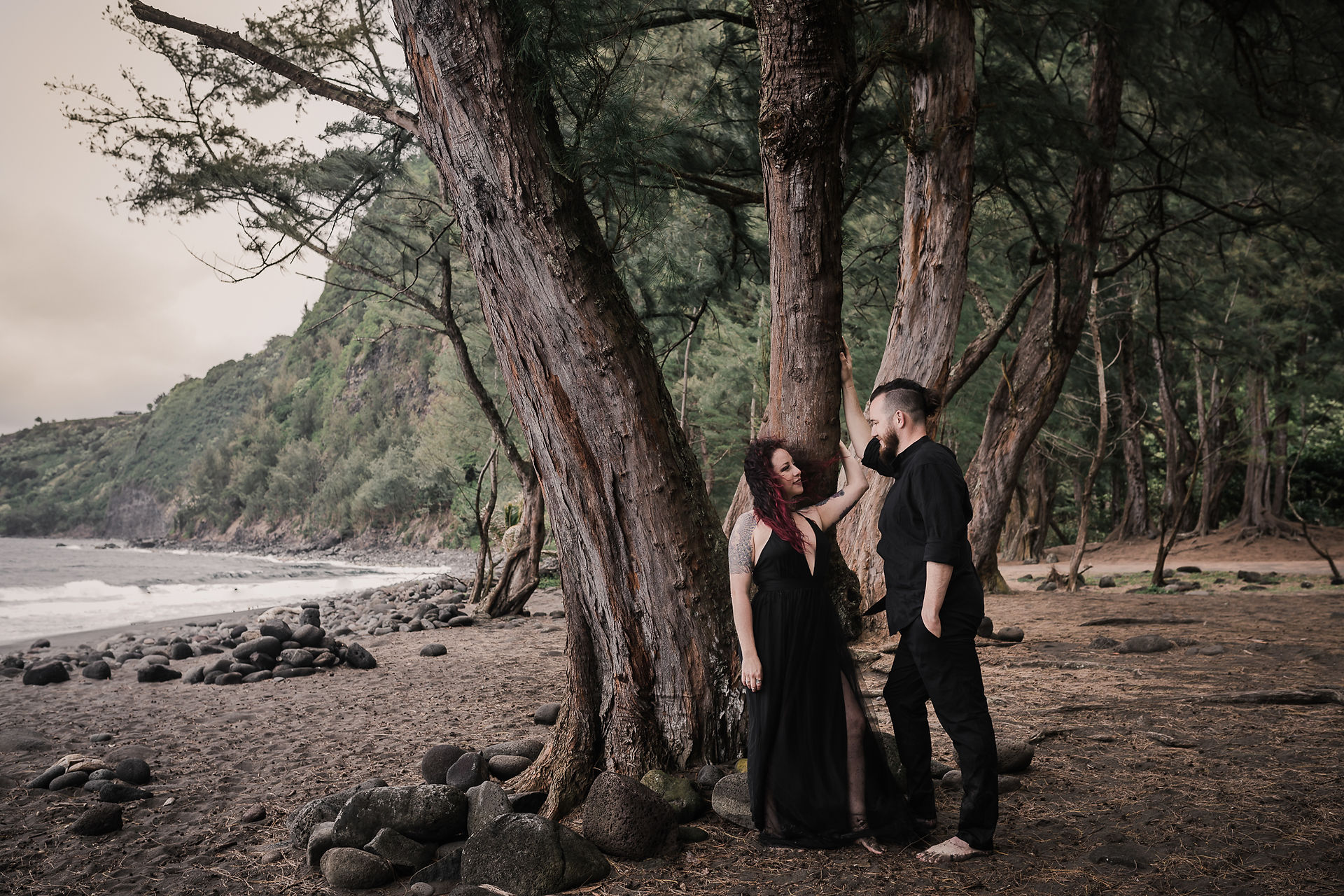girl leaning against tree flirting with guy