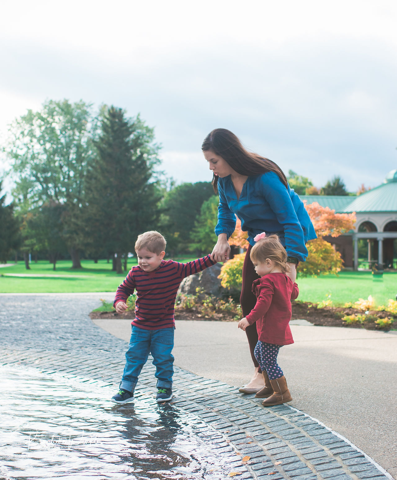 Mom with kids by the water fountain