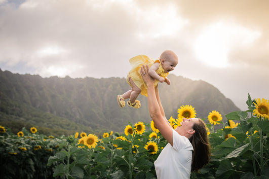 Mom throws daughter up in the air