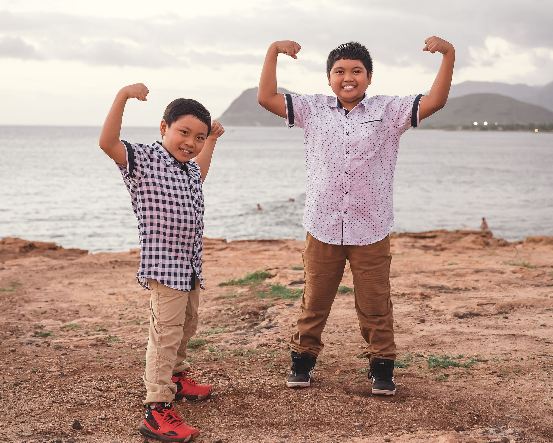 brothers showing off their muscles