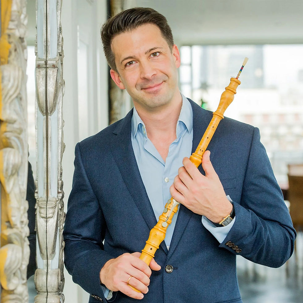 Guest musician holding an oboe