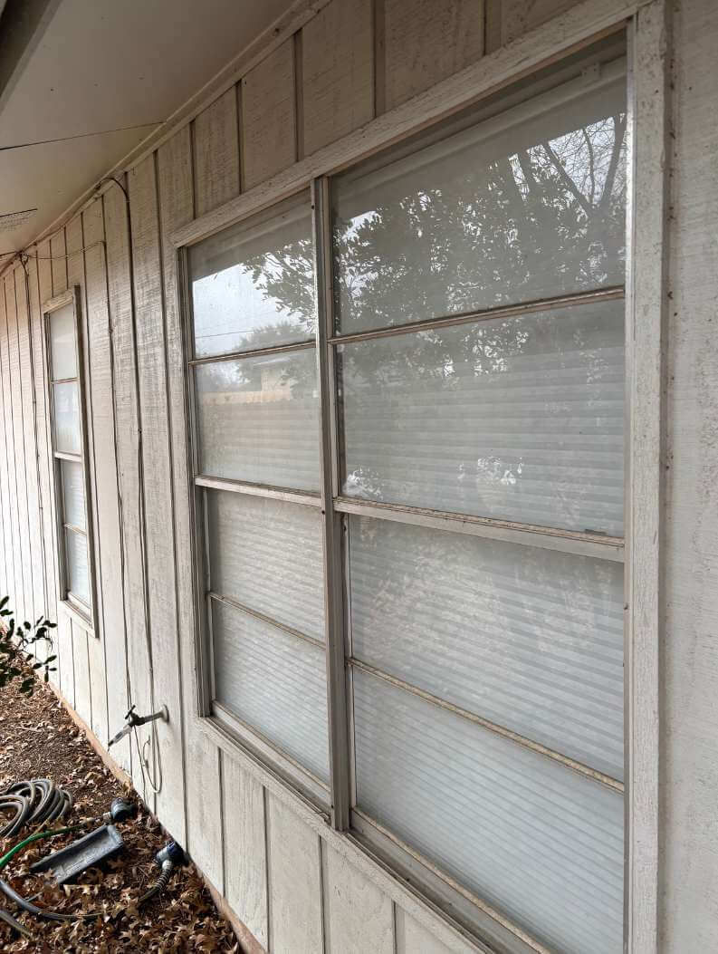 Outdated single-pane windows on an older home.
