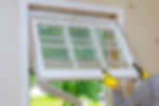 A picture of a window technician removing old, outdated windows in a San Antonio home.