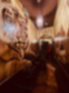 Giant tiger mural in hallway at Mango Thai Tapas with ambient lighting – ideal for unique celebratio