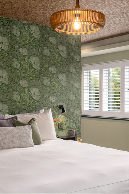 Stylish Swanwick bedroom featuring a leafy statement wall, golden ceiling and soft green tones for a calm, luxe finish.