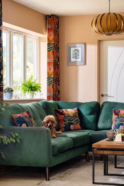 Mid-century inspired open-plan kitchen, dining and snug with bold retro teal organic colours and textures