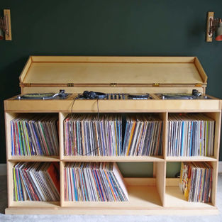 Bespoke wooden dj booth with vinyl collection storage.