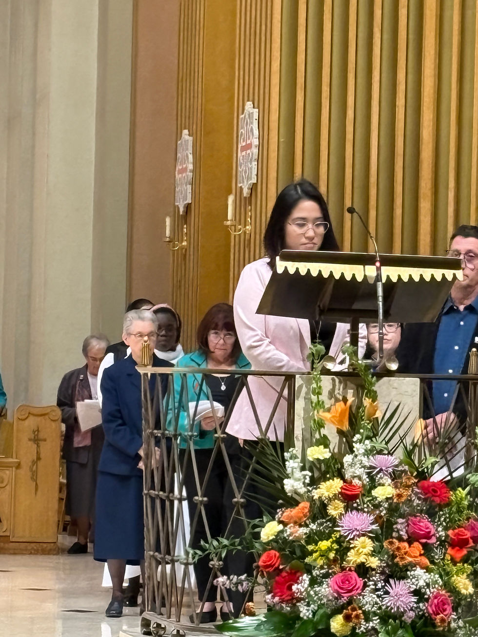 Sr. Rezebeth Noceja, SP reading an intercession in Tagalog during the mass.