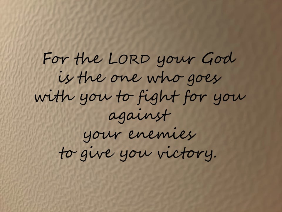 a Bible quote " for the Lord your God is the one who goes with you to fight for you .."on a golden background  written in script
