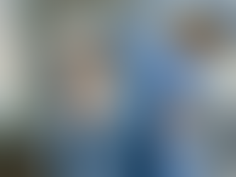 Mary, Mother of Jesus, in blue with halo and heart emblem, praying beside a white-clad angel in flower-decked setting. Text: Immaculate Heart of Mary and symbolism of forget-me-nots. Messages of Hope and Peace for the World.