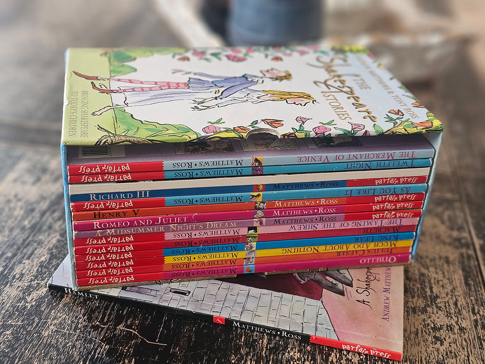 Stack of colorful children's books on Shakespeare on a wooden table, with titles visible. The mood is educational and whimsical.
