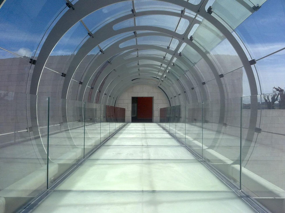 curved glass panels for an exterior walkway