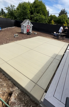 Simple concrete patio in Vancouver, WA backyard