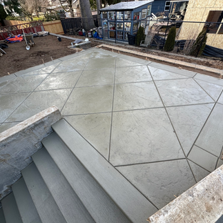 Backyard concrete patio with geometric design