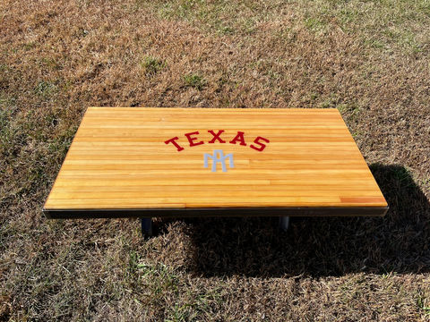 Overhead view of coffee table featuring Texas A&M logo