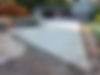 Newly poured concrete driveway with broom finish - Client Testimonials Toki Concrete