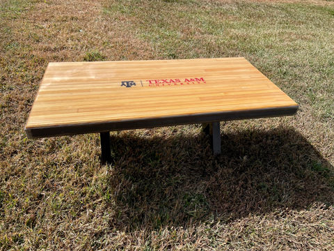 3/4 of Texas A&M table with university logo