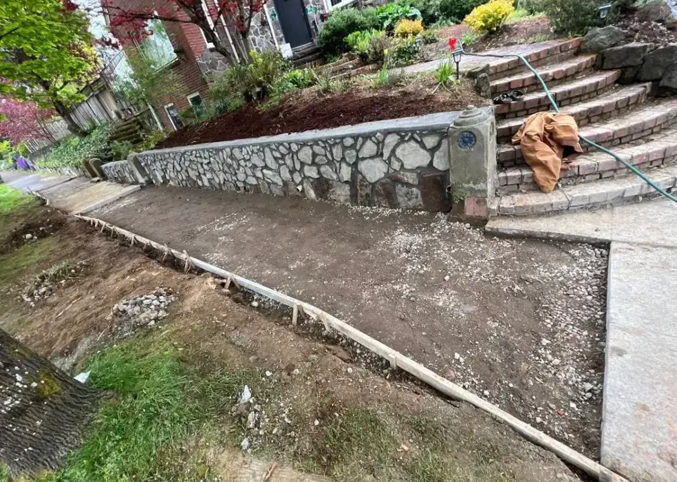 Preparing for new concrete sidewalk replacement outside residential Vancouver home