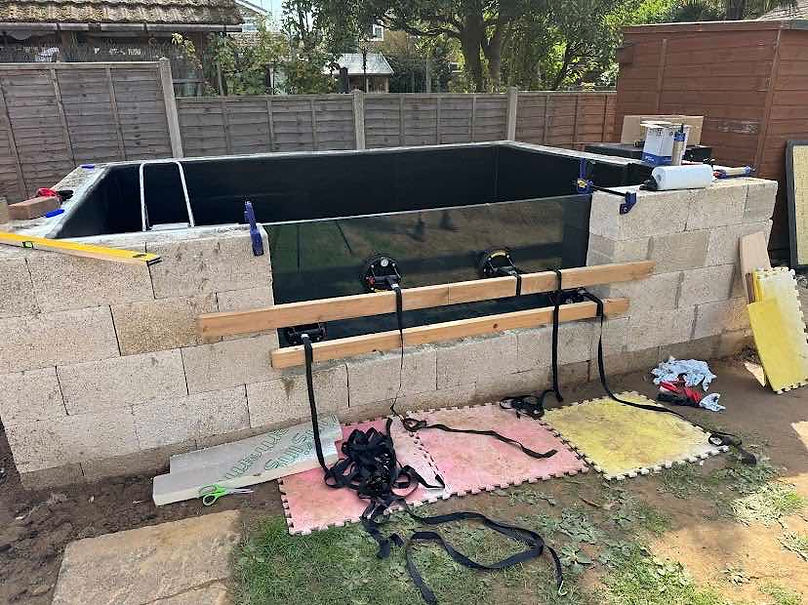Close-up of a 33mm laminated pond glass panel used for deep pond viewing