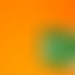 A green and white emergency exit sign on an orange background