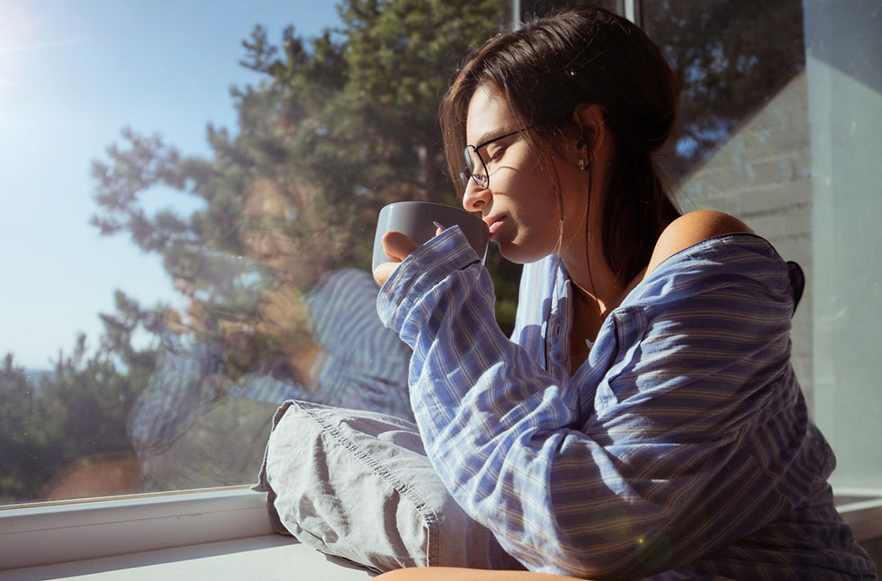 woman drinking coffee feeling confident and consistent with success plan
