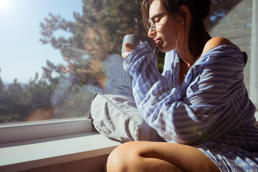 confident young woman drinking coffee with a plan for consistent action