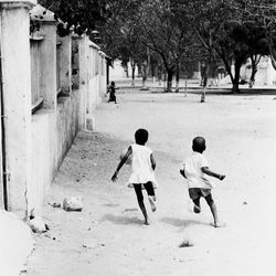 Chasing a soccoer ball Goree Senegal WA