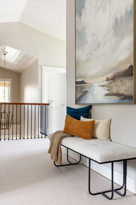 hallway, large scale art, pillows, bench, master bedroom suite