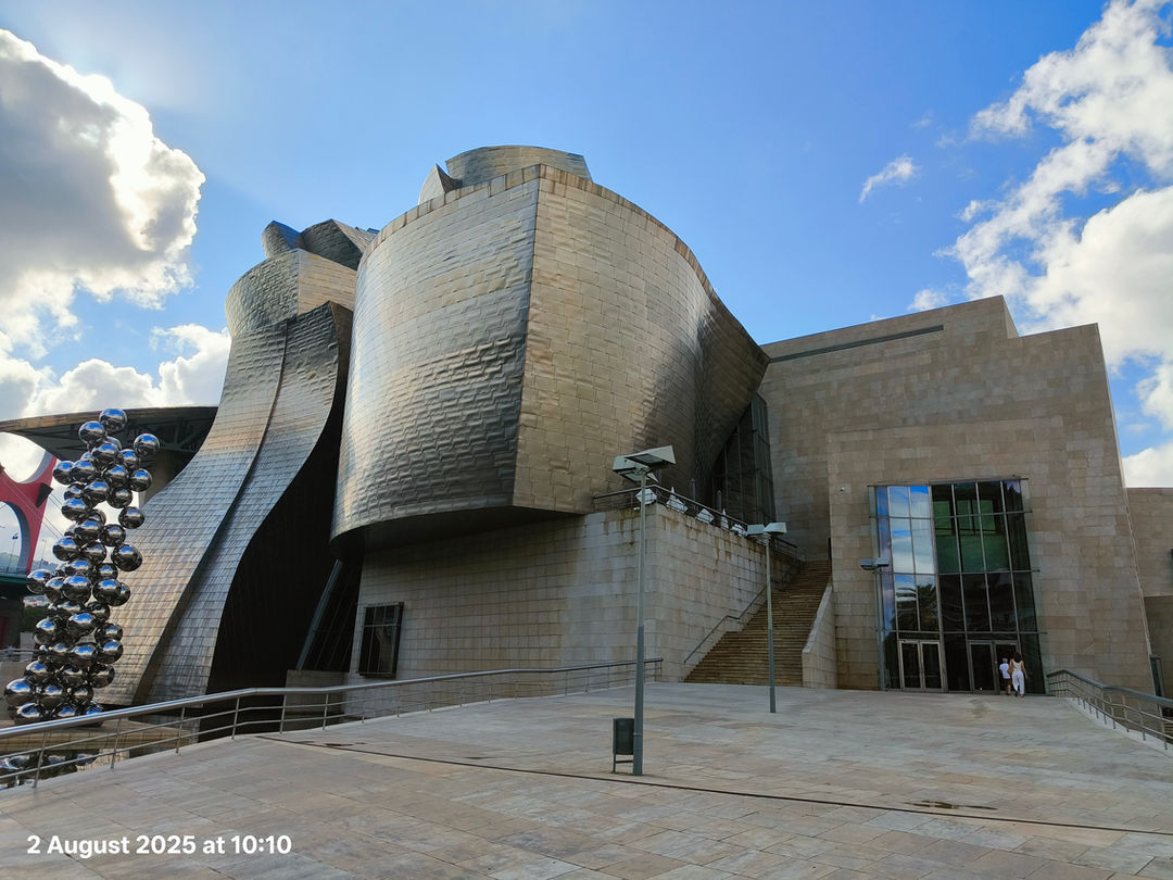 This photo was taken by myself, as we were visiting Bilbao, during my summer holidays.
In the photo, you can see the Guggenheim museum, designed by Frank Gehry. This building is a wonder to me and to anyone interested in architecture as the amazing use of organic shapes have been perfectly used together to create one of the most famous buildings in the world.