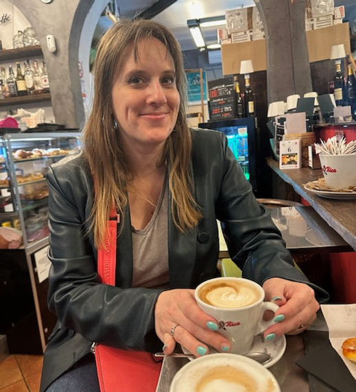 A woman drinking coffee in Italy
