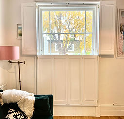Solid raised plantation wooden shutters installed in Wood Green