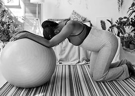 "Embrace the power of pre and early labor with Born to Birth prenatal classes. This captivating image showcases a woman finding comfort and strength on her hands and knees with a birthing ball—an essential tool in optimizing labor and birth. Recognizing the significance of these early stages, our evidence-based approach empowers mothers to navigate this crucial phase with confidence and grace. Join us to learn holistic techniques that promote a smooth and empowering birthing journey."