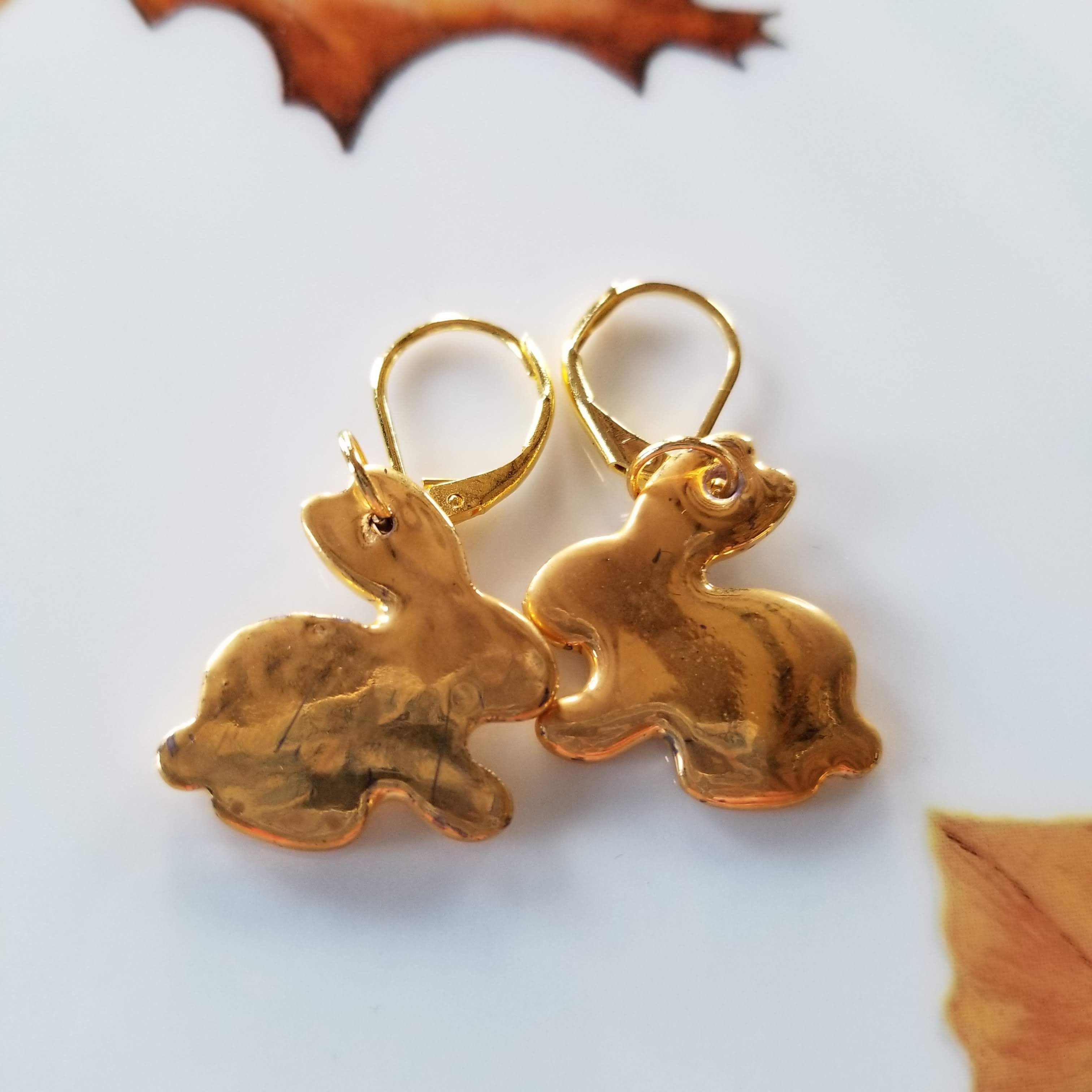 boucles d'oreilles petits lapins  en porcelaine dorée à l'or fin
