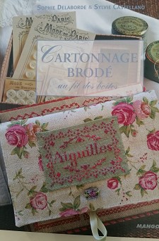 livre cartonnage brodé
