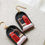 Thumbnail: Black "Telephone Box  in Snow Globe" Polymer Clay Earrings