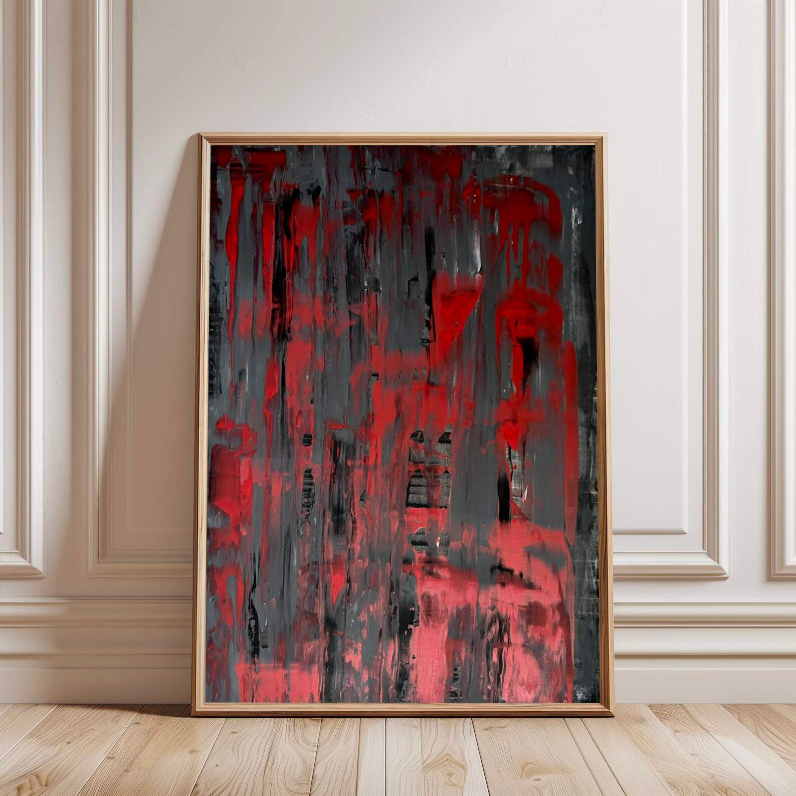 Abstract painting with red, black, gray strokes, framed, on wall
