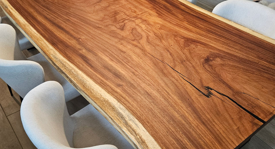 Live-edge Monkeypod epoxy river dining table built by Exotic Wood Depot in Orlando, Florida.