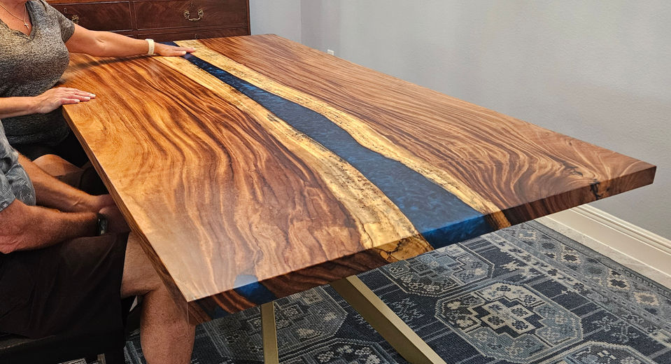 Live-edge Monkeypod epoxy river dining table built by Exotic Wood Depot in Orlando, Florida.