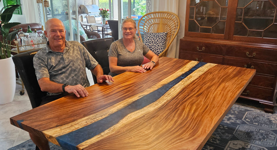 Live-edge Monkeypod epoxy river dining table built by Exotic Wood Depot in Orlando, Florida.