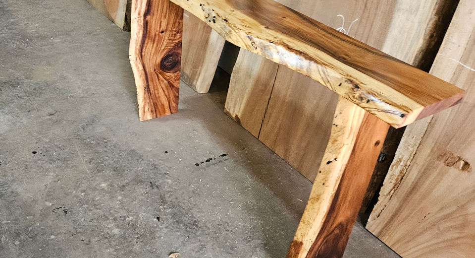 Live-edge Monkeypod epoxy river dining table built by Exotic Wood Depot in Orlando, Florida.