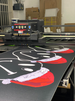 Direct To Print Boards Being Printed On PVC Boards For A Christmas Party
