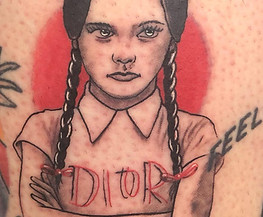 small Wednesday traditional tattoo by Art & Ink Tattoo Gallery in Woodstock GA
