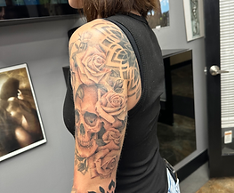 Black and grey Skull custom tattoo created at Art & Ink Tattoo Gallery
