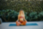 Sena doing yoga and giving a calm smile