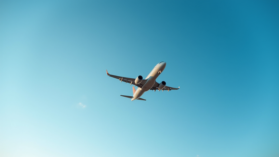 Eye-level view of an airplane taking off against a clear blue sky